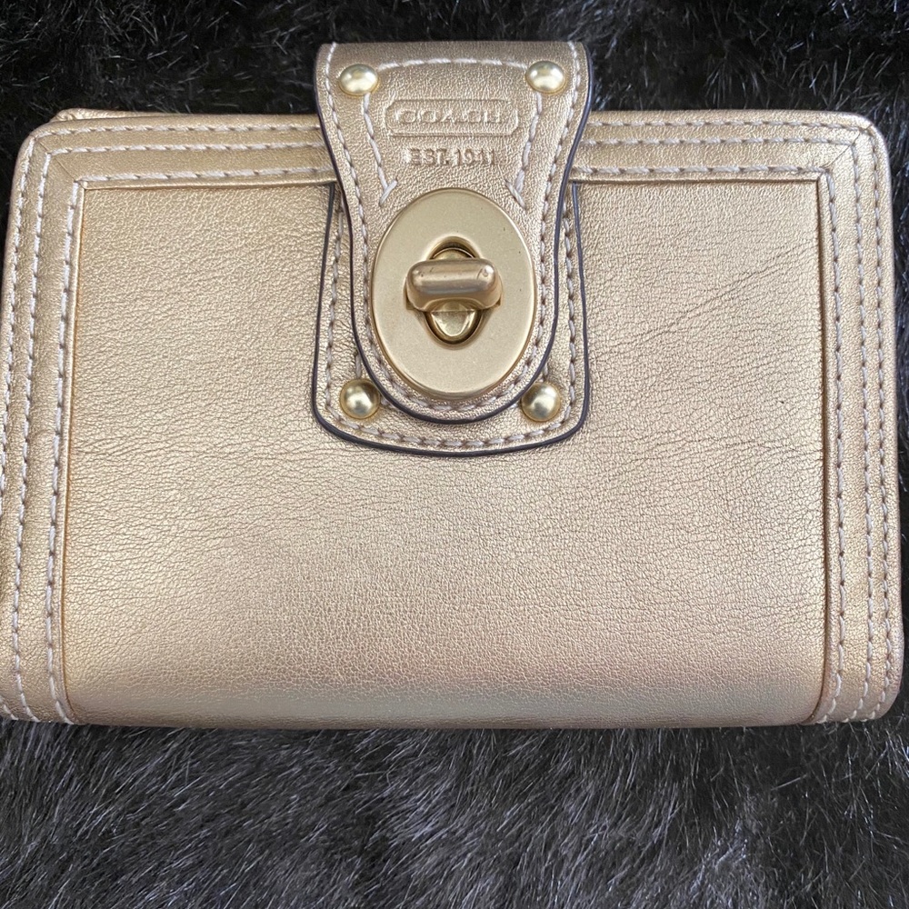 Coach gold passport holder
